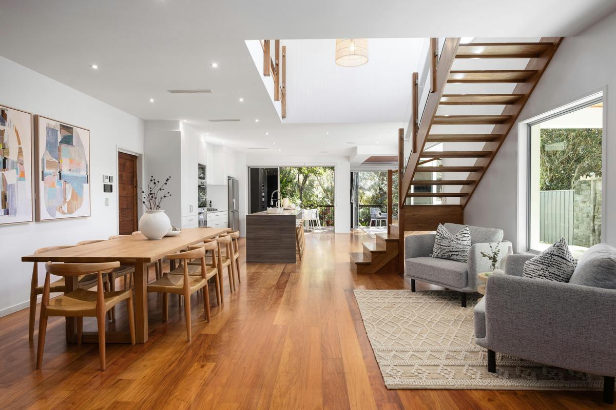 Spanning two levels with six bedrooms, three bathrooms, and multiple living areas.