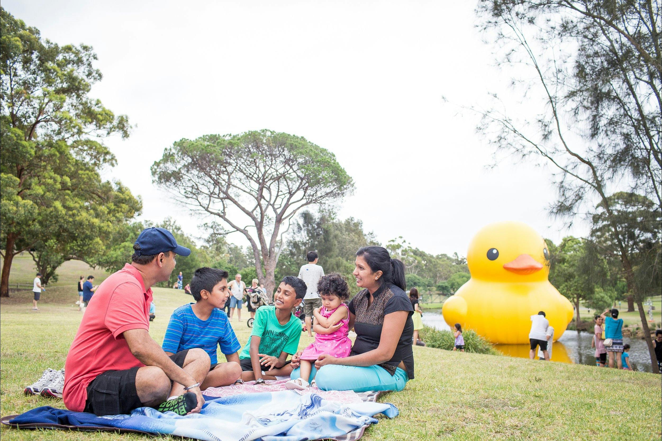 Family picnics in Parramatta Park during Sydney Festival