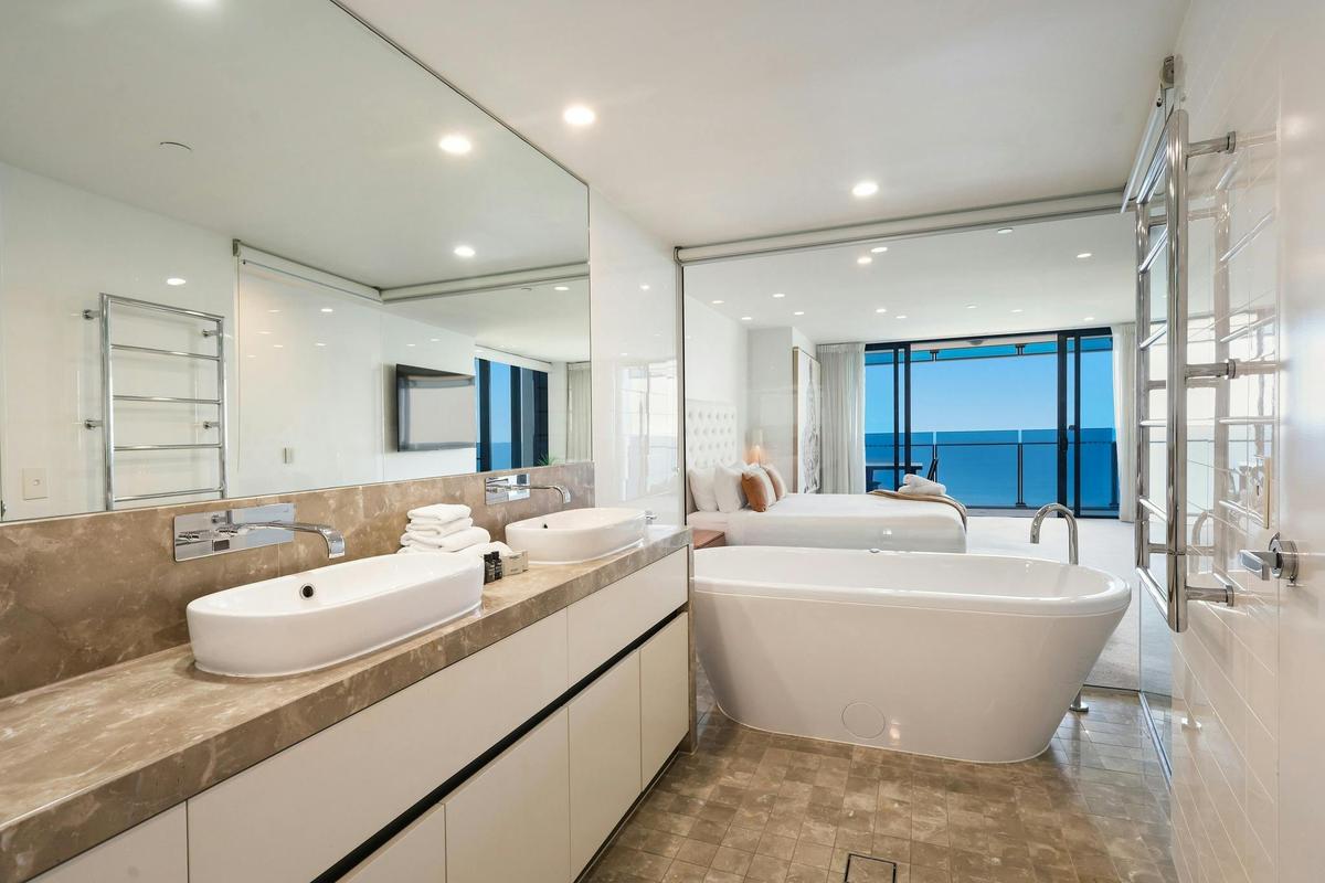 Main ensuite with bath tub, granite finishes, warming towel holder and ocean views - Gold Coast