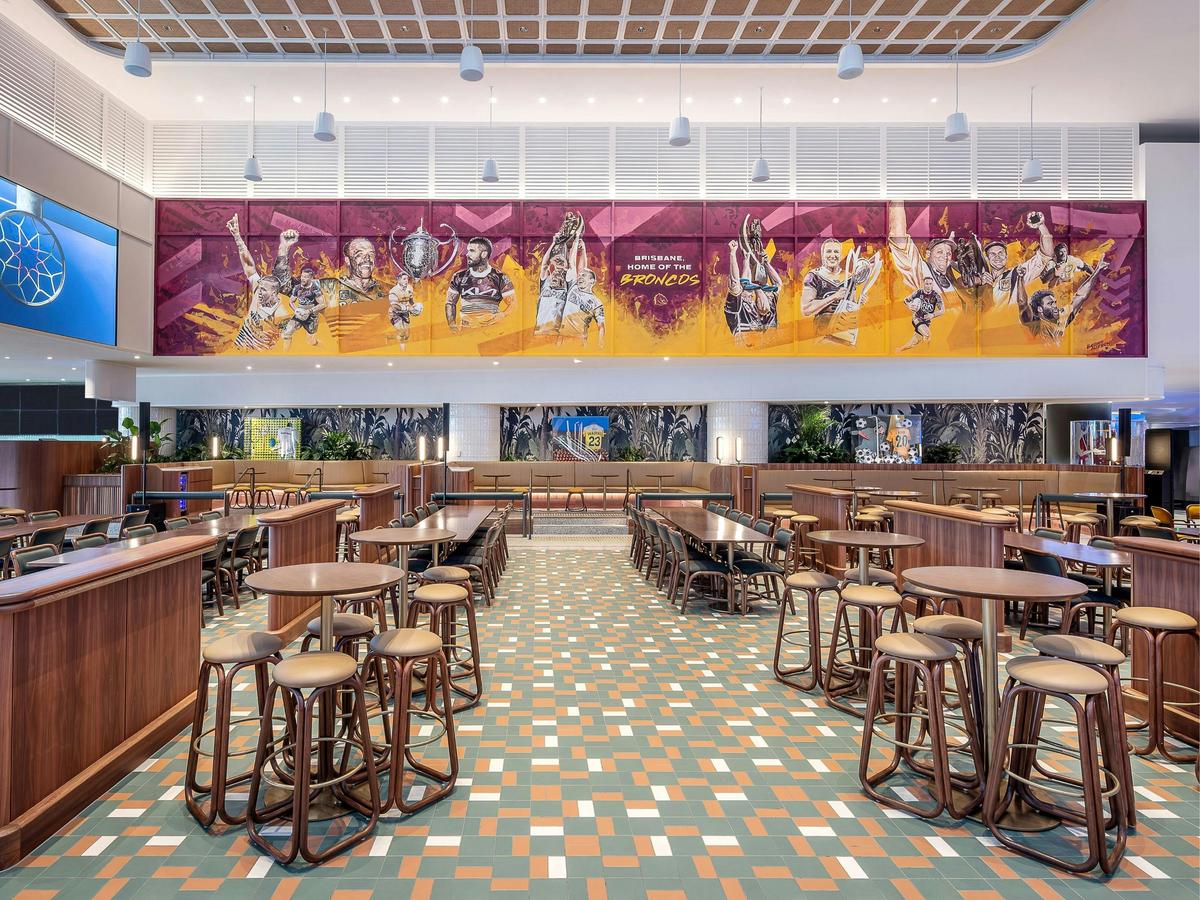 A large bar area with a Broncos mural
