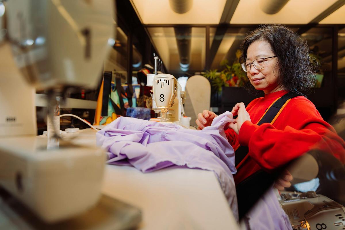 Woman using sewing machine