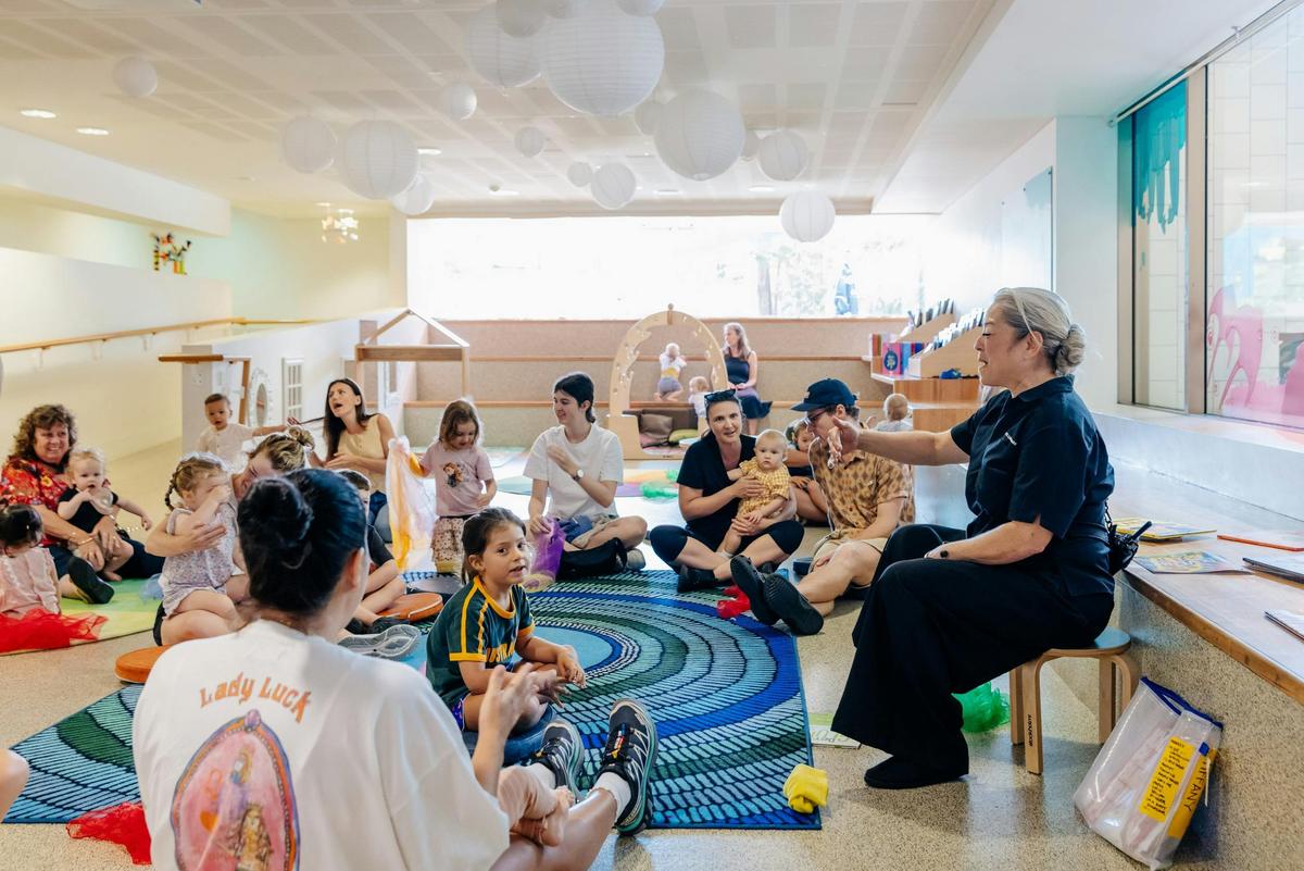 families and children playing in a circle
