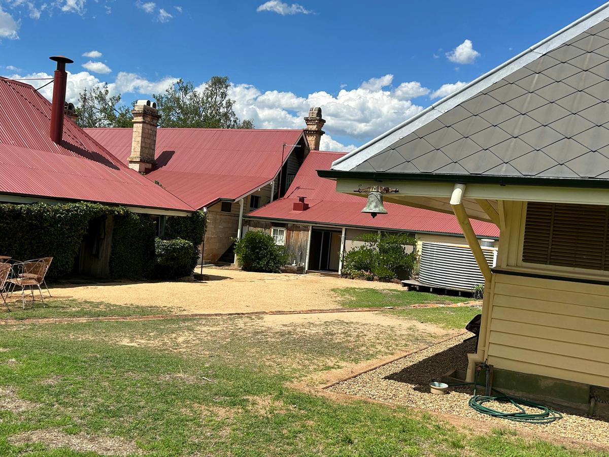 Rear of Taabinga Homestead with detached kitchen on the right and portion of  diary