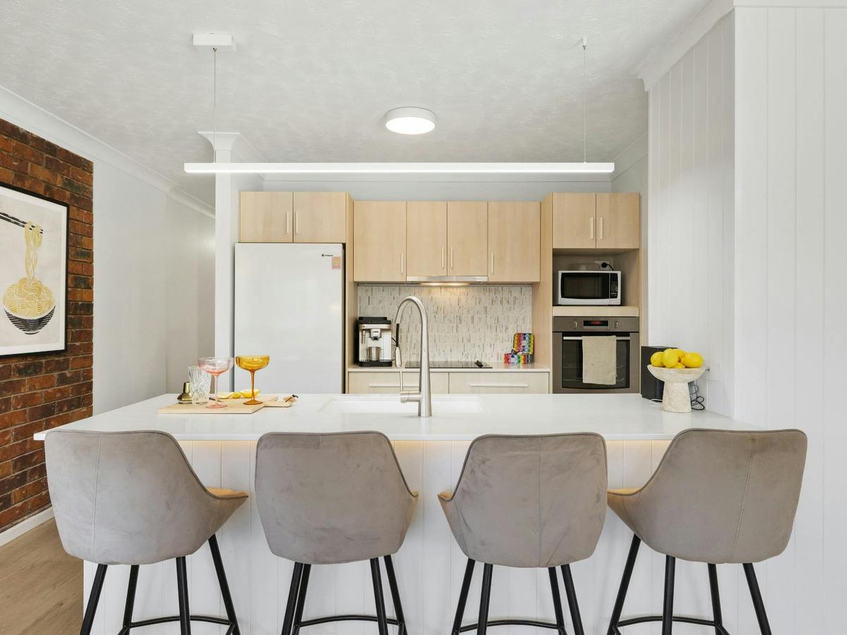 Open-plan kitchen with breakfast bar and Coffee machine