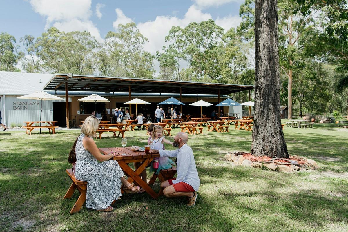 Family enjoying a beverage at Stanleys Barn