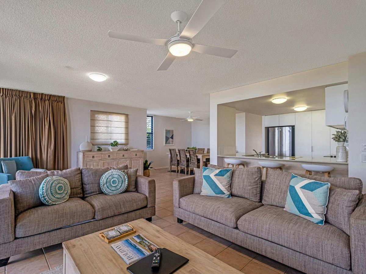 Open plan lounge area with Smart TV and balcony access