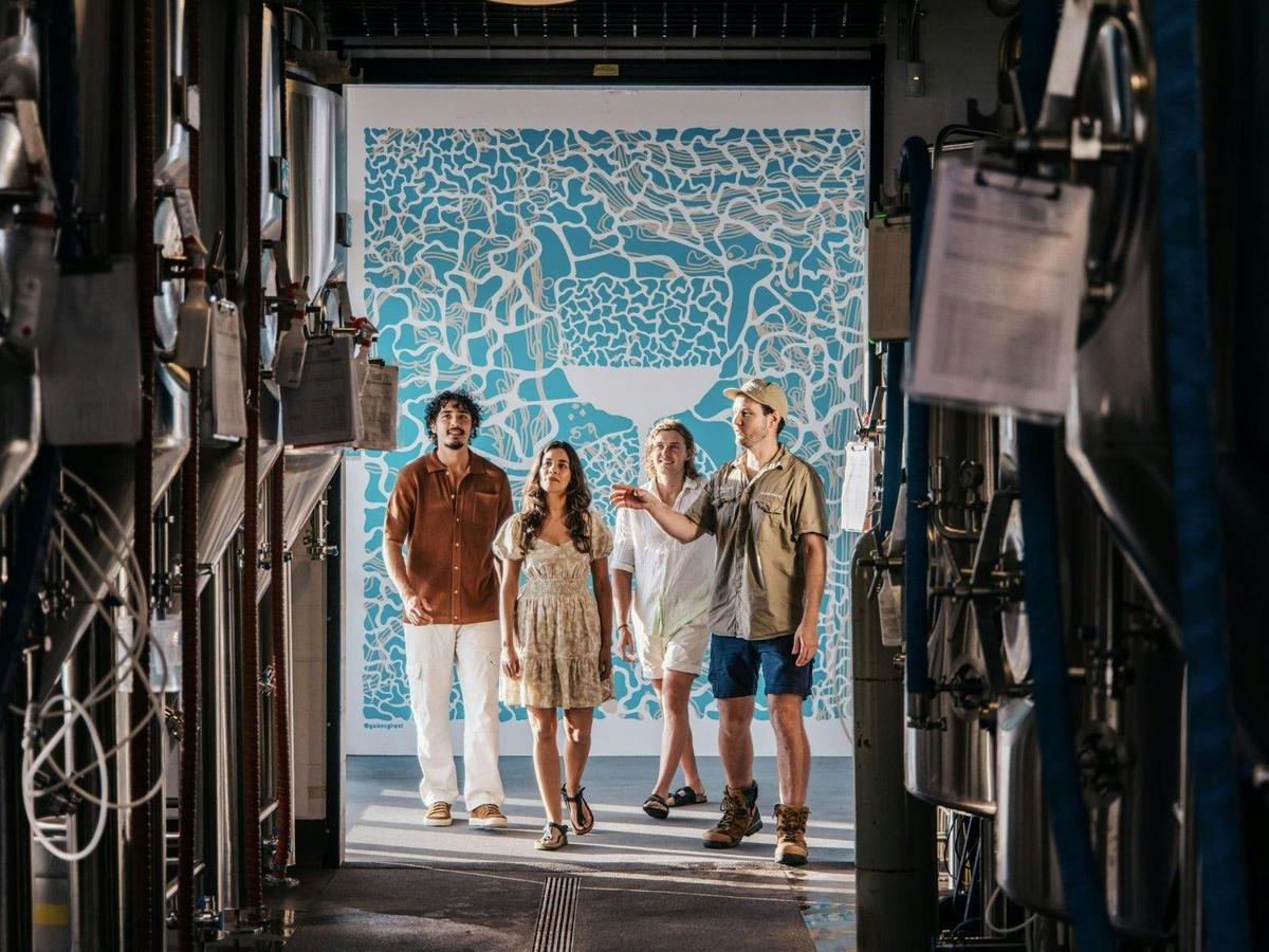 Head Brewer Andrew takes a group Behind the Tanks