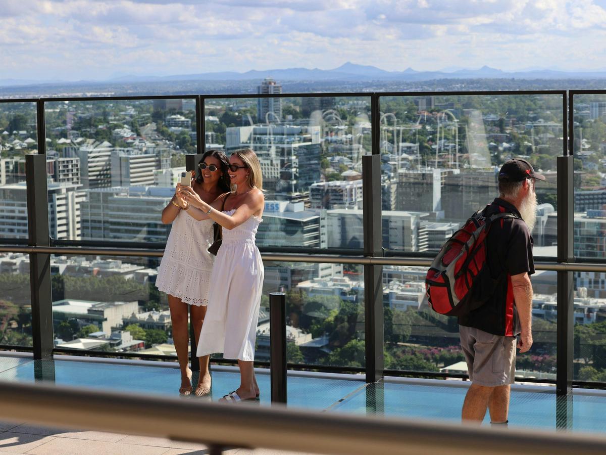 People taking selfies with the view on Sky Deck