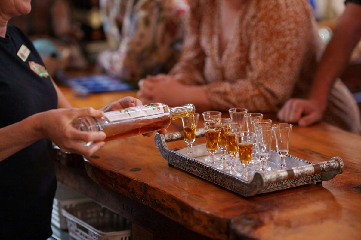 drinks being poured on a bar