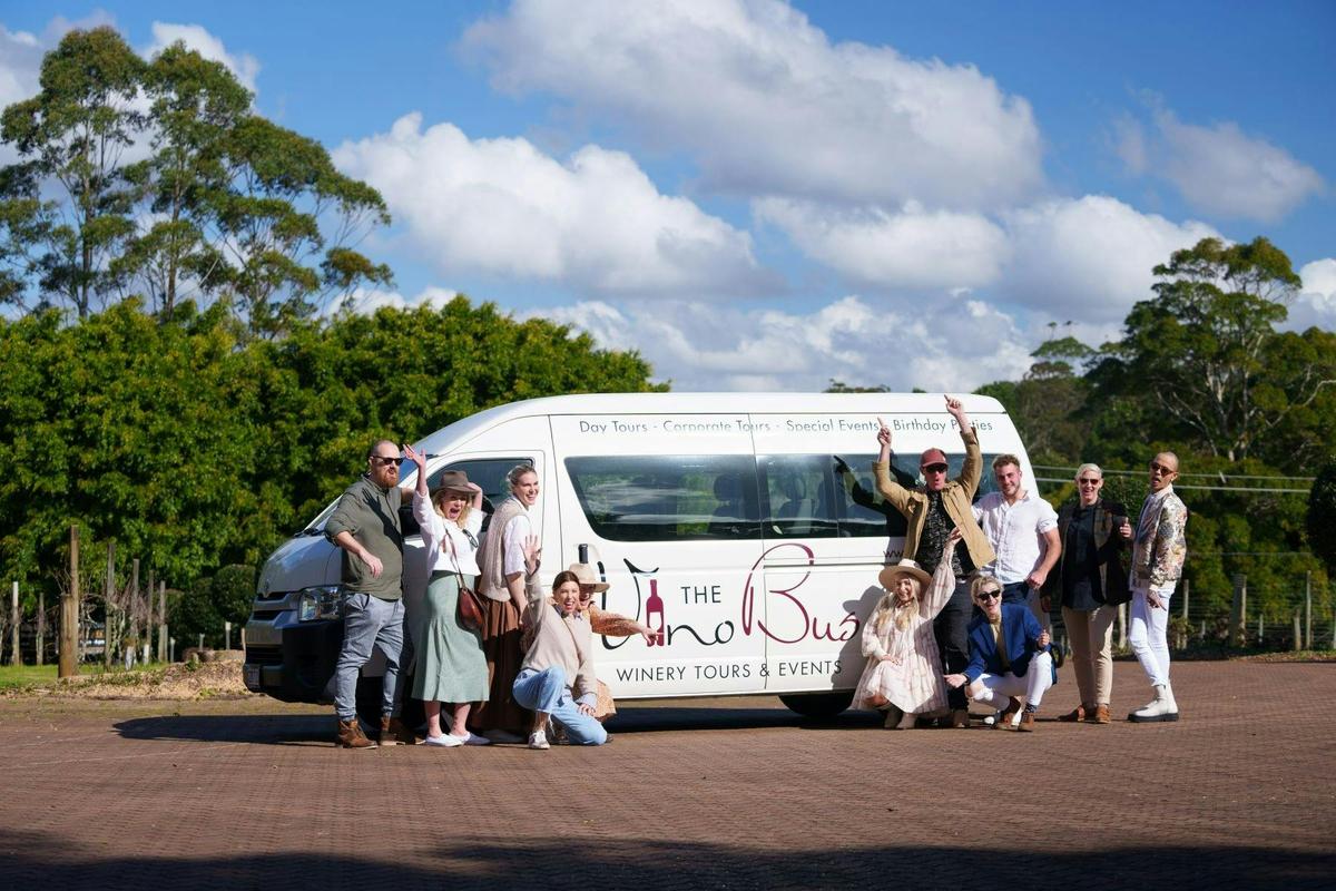 mini van with guests in front