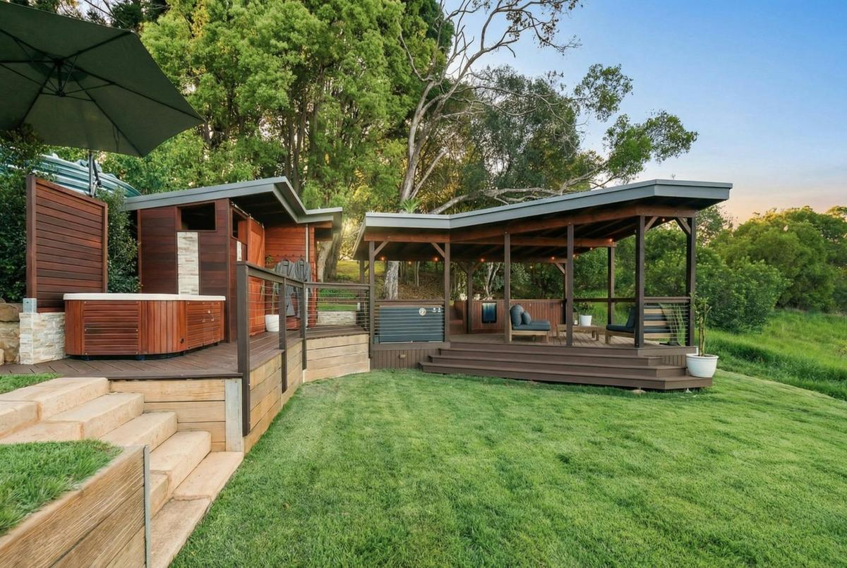 The outdoor spa relaxation deck at The Range, nestled in the Montville hinterland