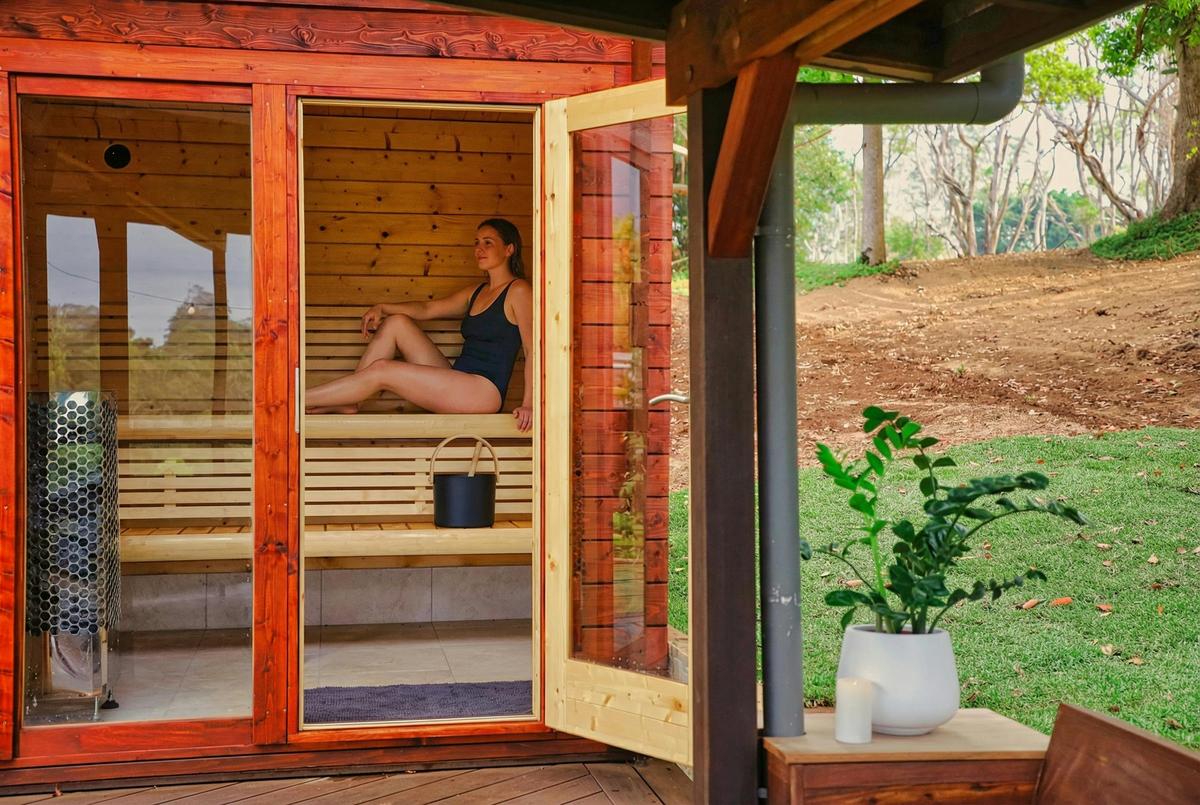 Guest relaxing in Finnish sauna at The Range Holistic Spa and Wellness, Montville Sunshine Coast
