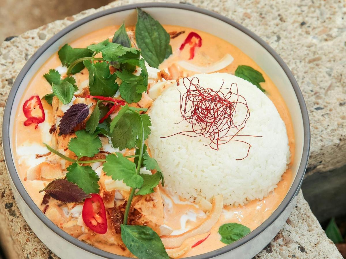 Slow-cooked beef cheeks yellow curry with coconut.