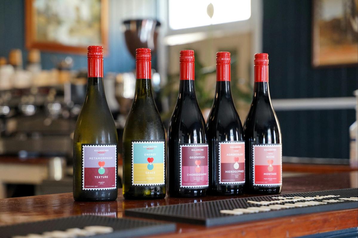 Five bottle of wine sitting on the bar
