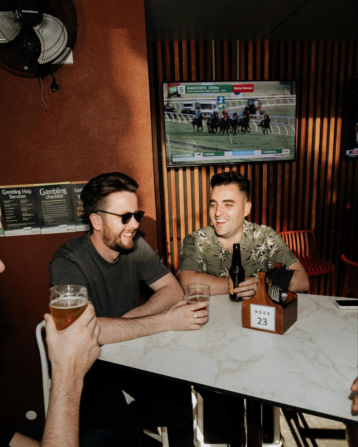Two men sitting and chatting