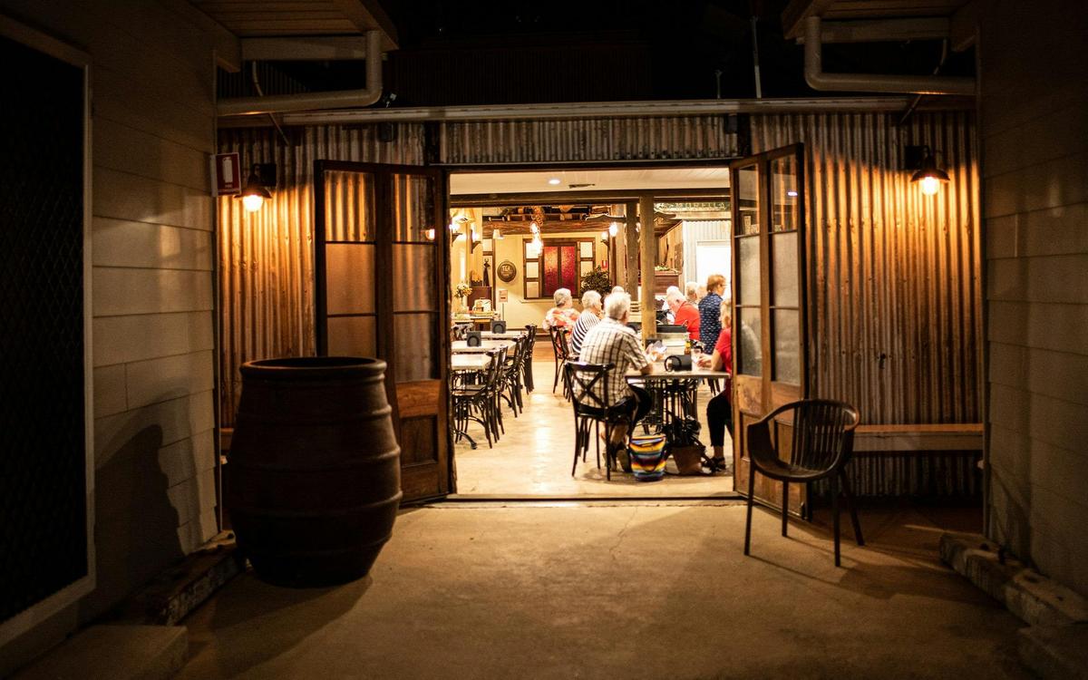The Welcome Home Dining Room Entrance with guests eating