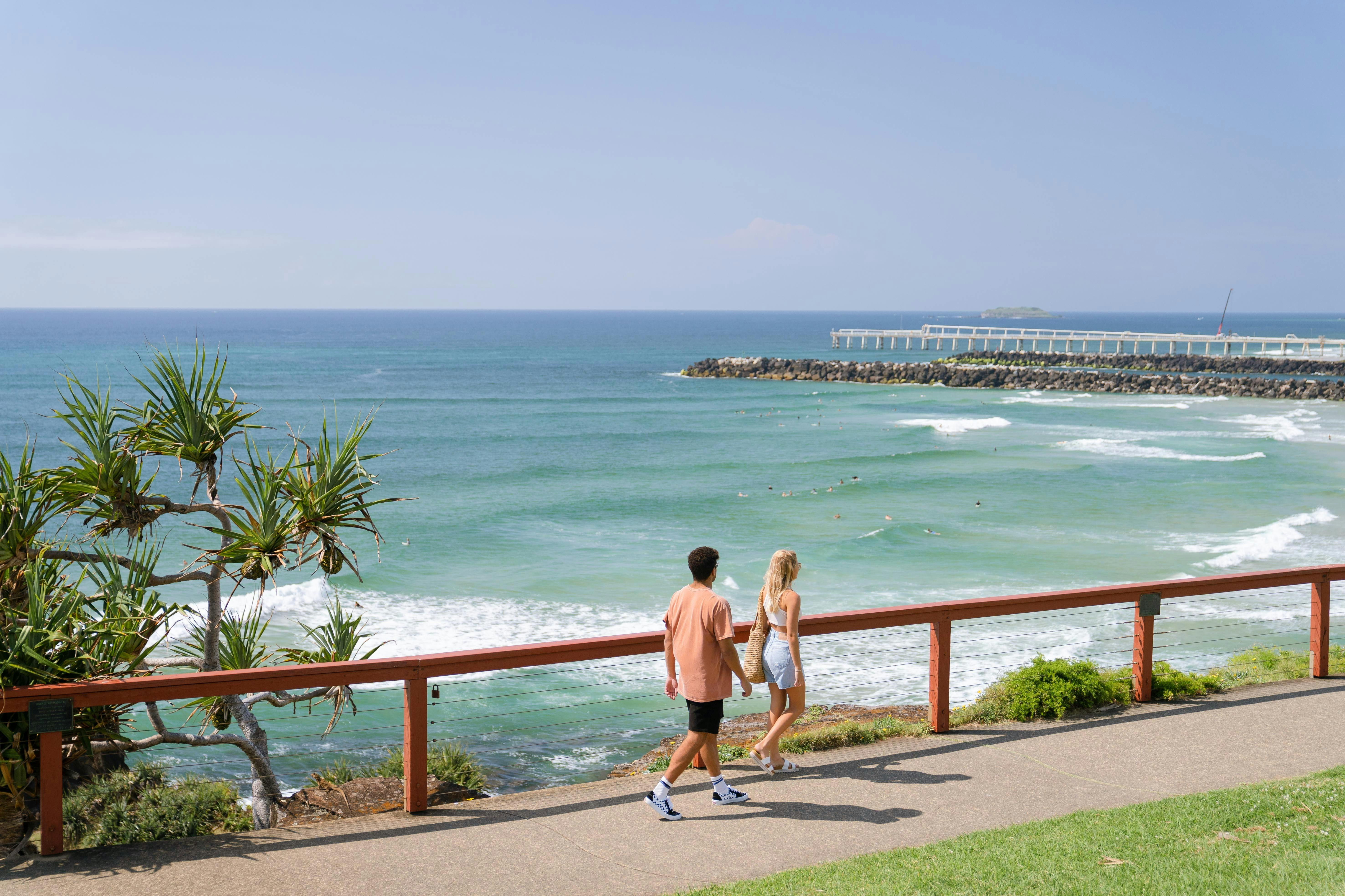 Couple walking at Point Danger Lookout