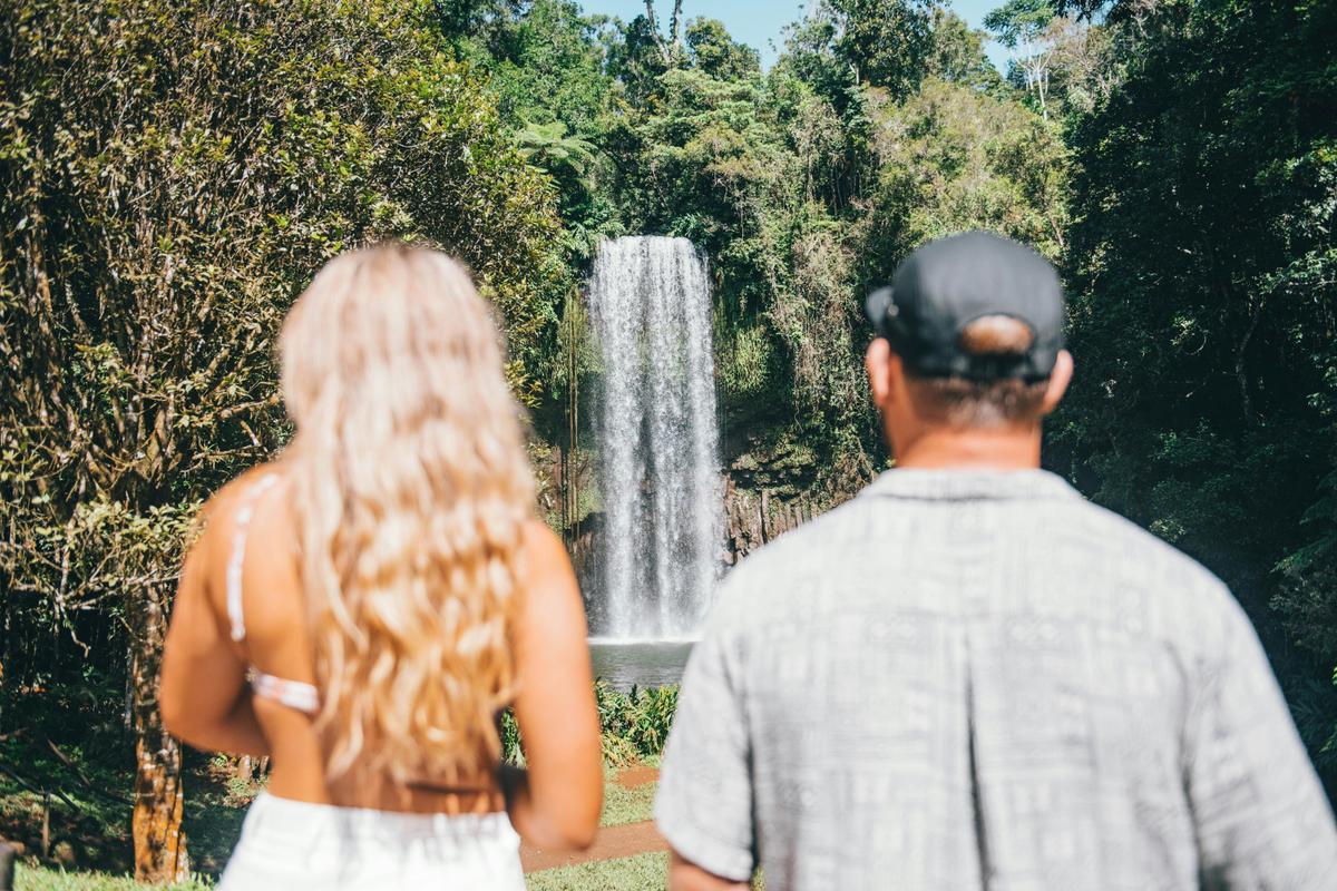 Couple Standing in front of Millaa Millaa on the Atherton Tablelands in Tropical North Queensland