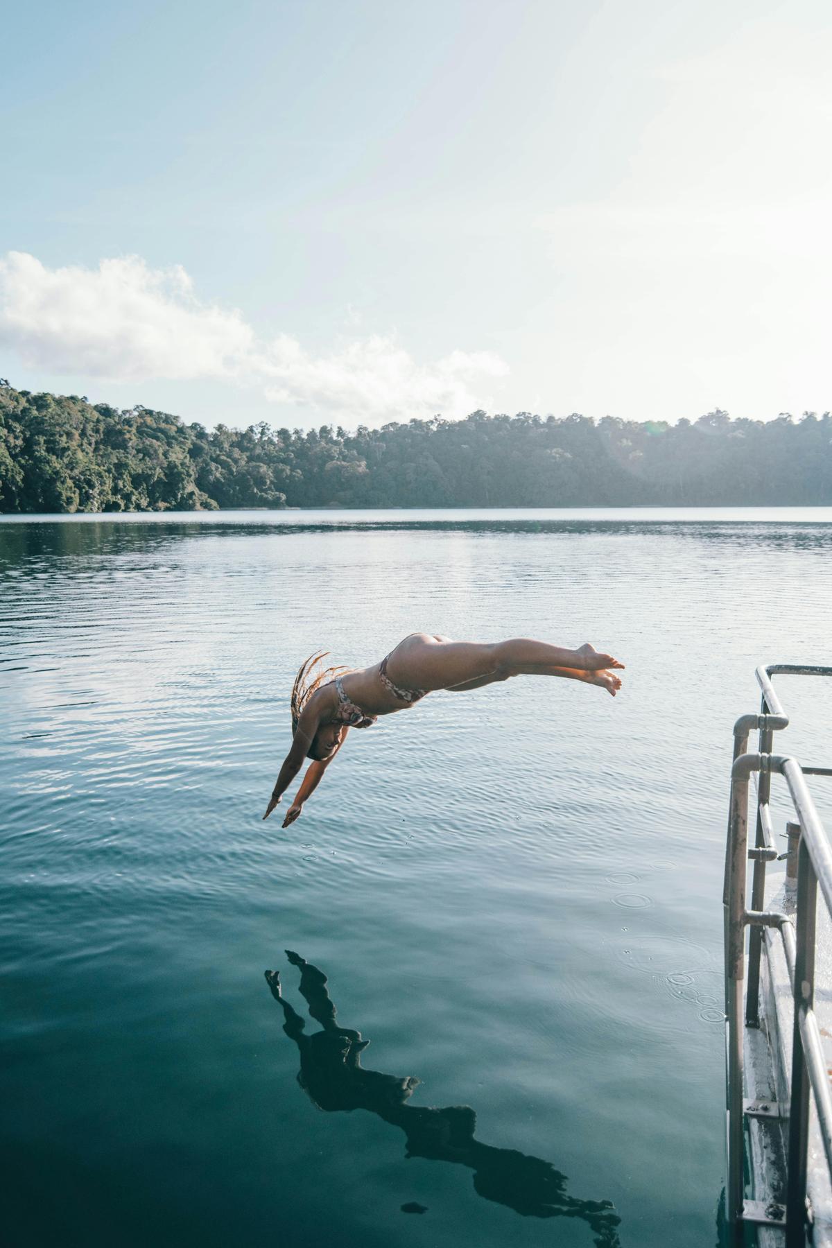 Diving of the dock at Lake Eacham on the Atherton Tablelands in Tropical North Queensland
