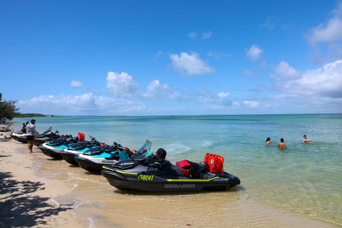 Tour group having a break and swim at Moreton Island