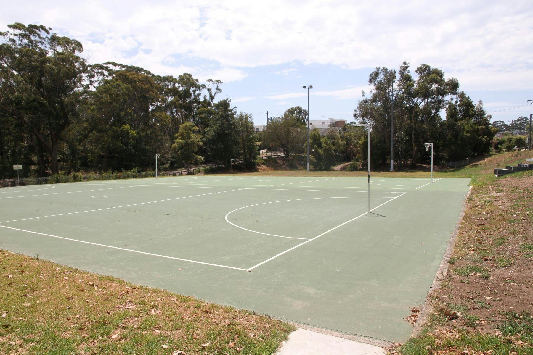 A netball court in Poulton Park sits in quiet anticipation.
