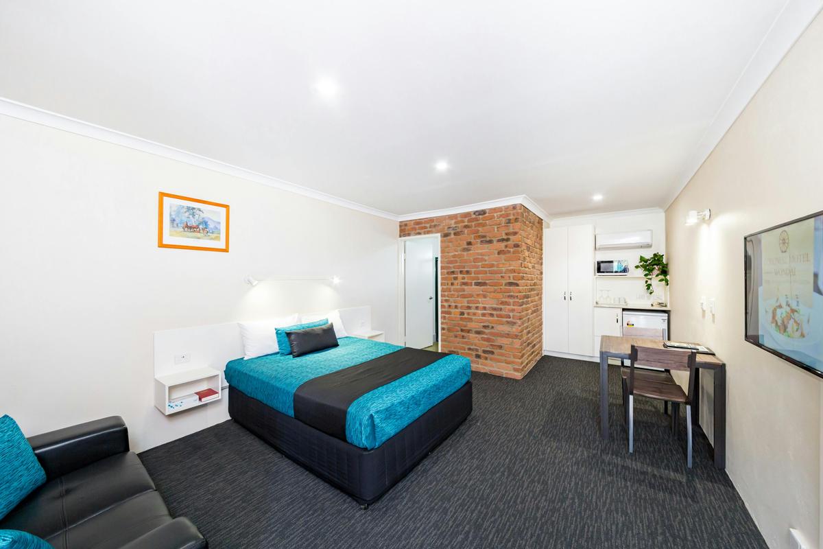 King room, recently renovated, lounge chair, table & chairs, smart tv, aircond, mwave, kettle, toast
