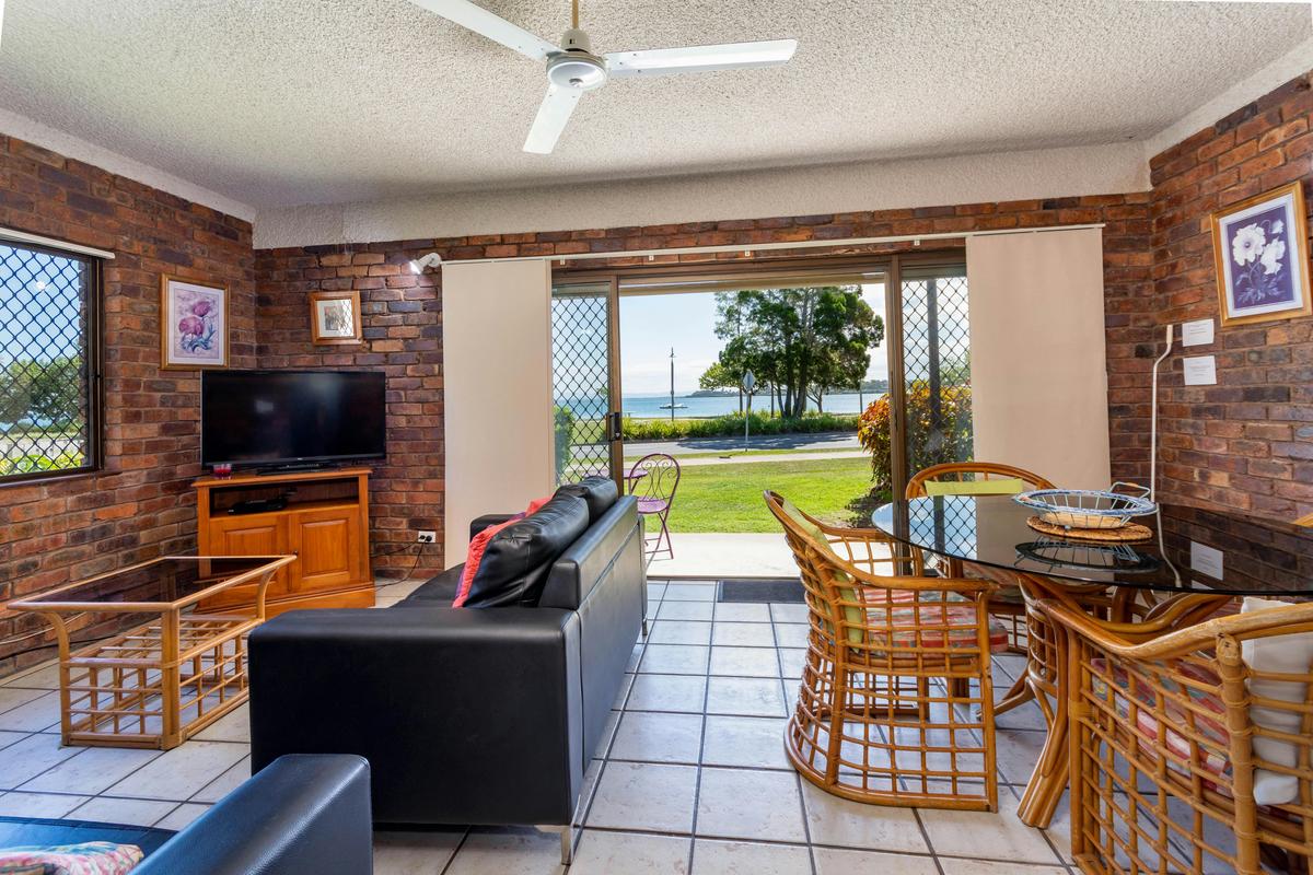 Lounge and dining area with water views