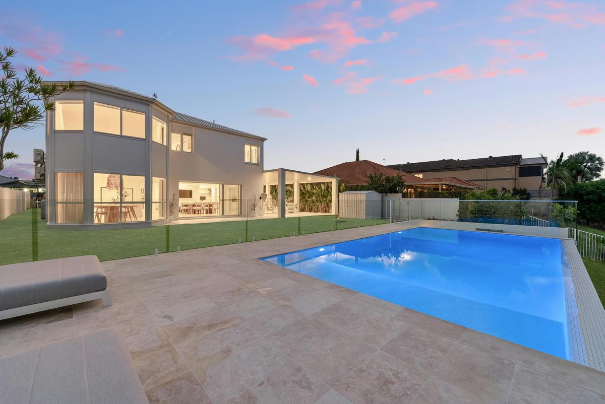 Twilight over the pool and travertine deck.