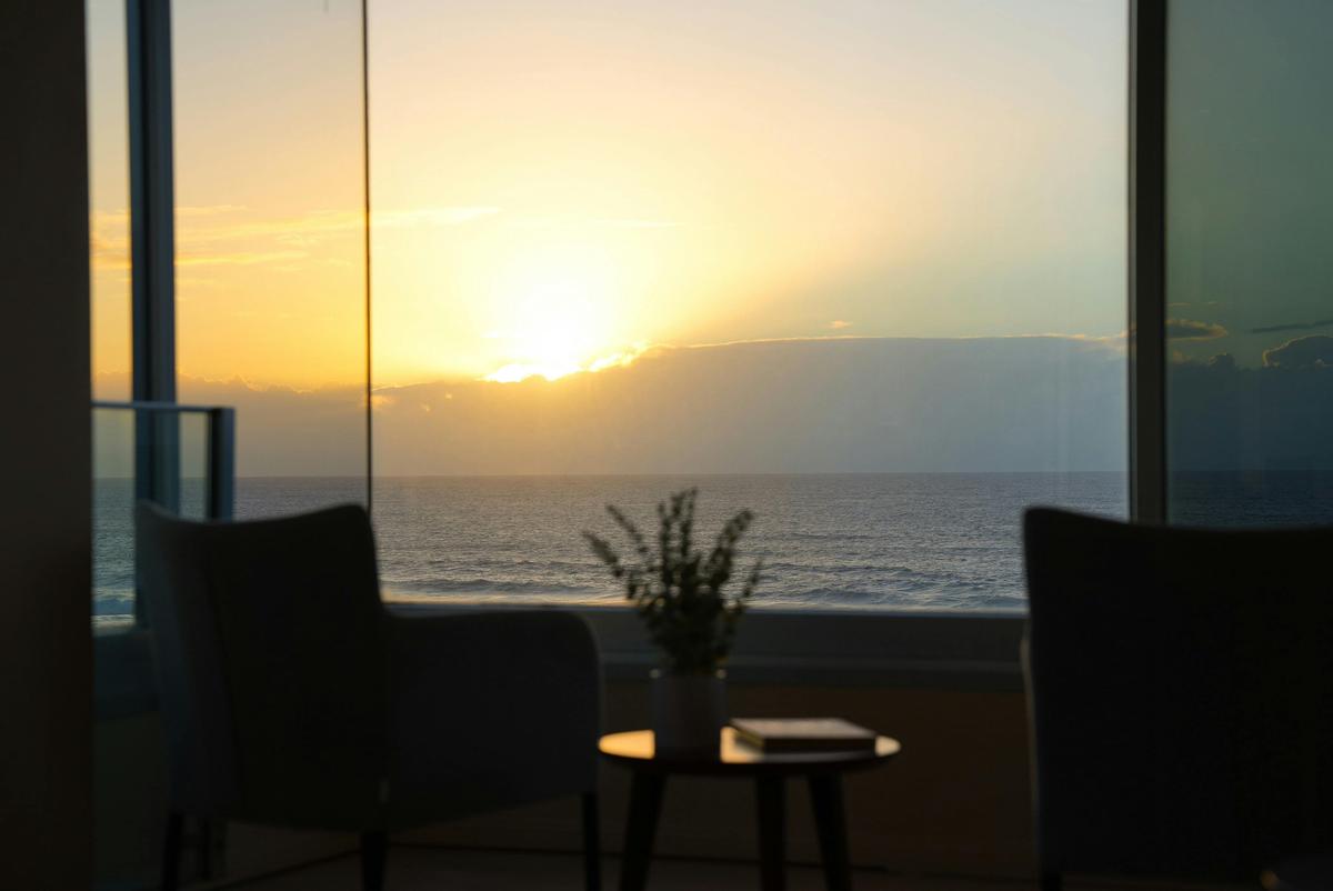 Sunrise over the water, straight ahead from the living room.