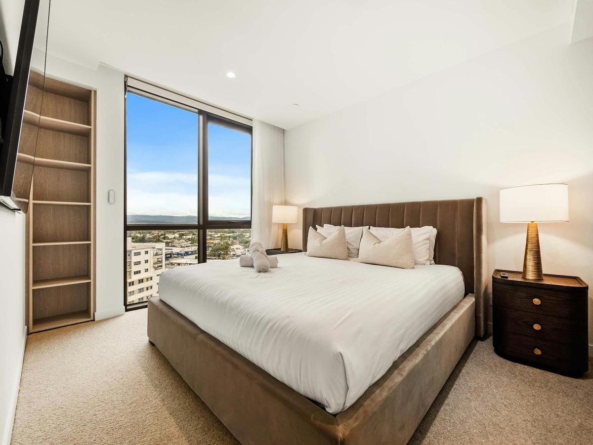 The second bedroom takes a queen, with built in shelving and a district outlook.