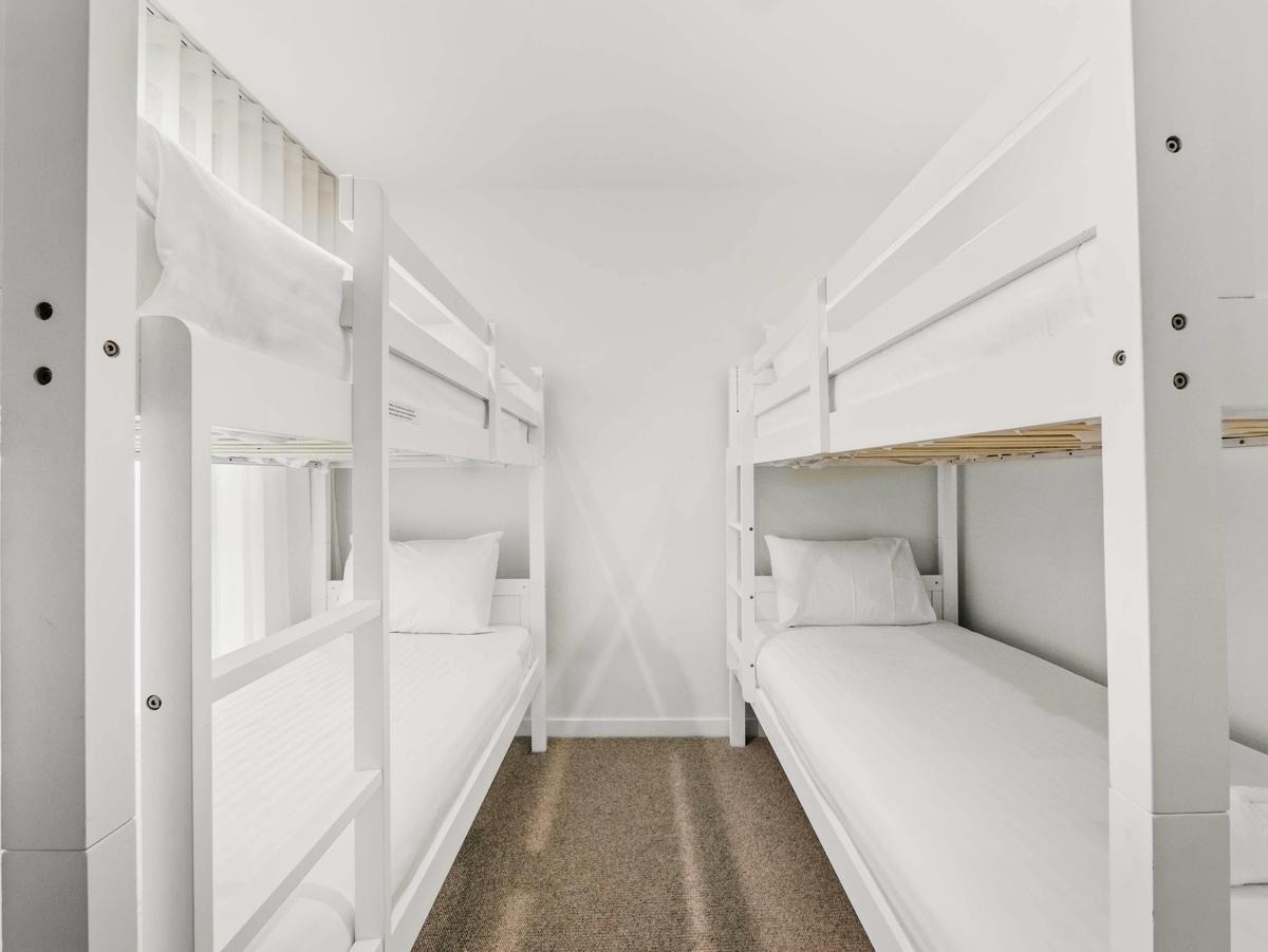 The first bunk room holds two sets of bunks, sleeping four.