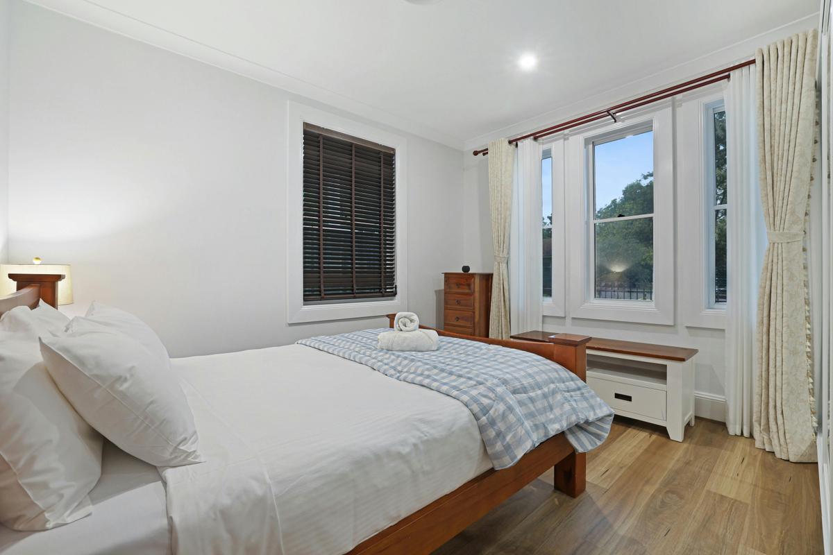 Master bedroom with natural light and storage