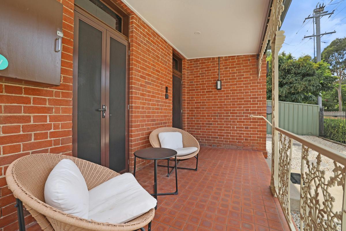 Front patio seating and entry doors