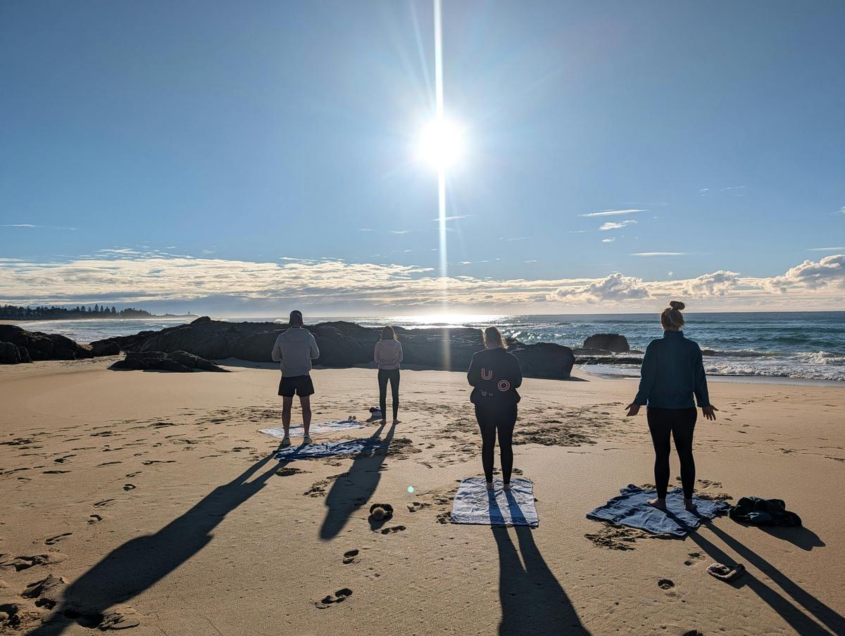 Sunrise practice: Participants greeting the morning sun at Simply Barefoot Ocean Wellness.