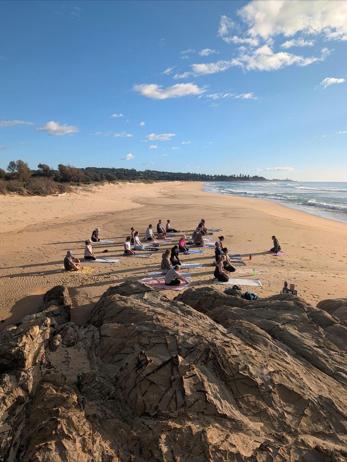 Our barefoot beach yoga classroom with views north along the coast towards Tuross Head, NSW.