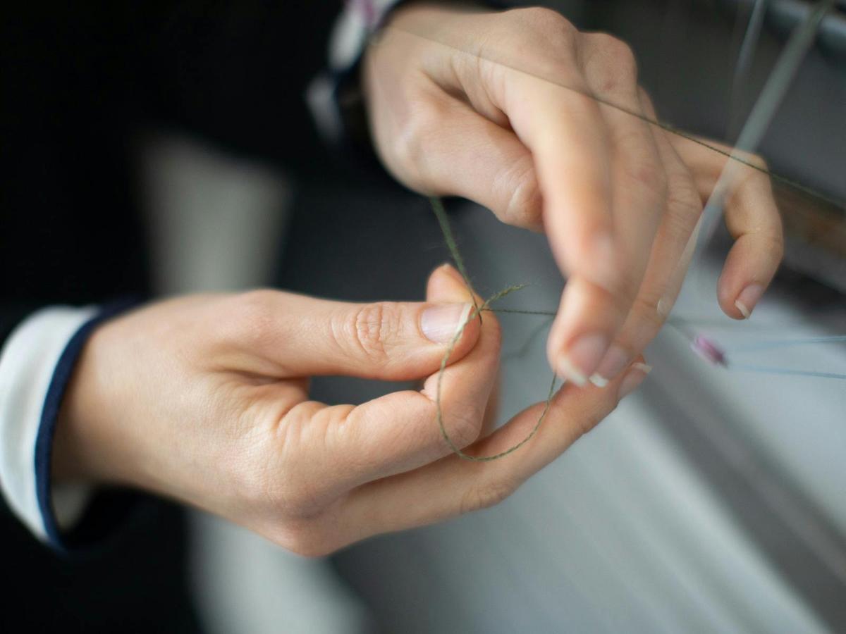 Brood Knitwear - Threading the Knitting Machine