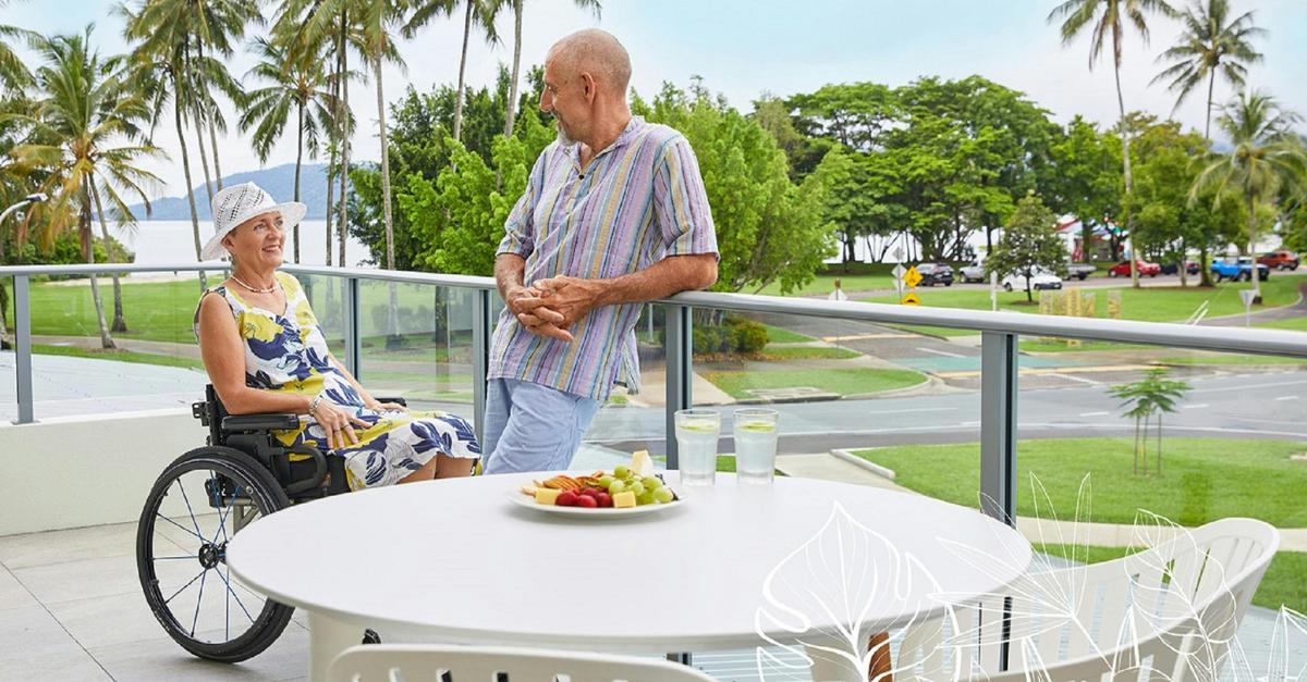 Guests chatting on a balcony - overloooking Trinity inlet