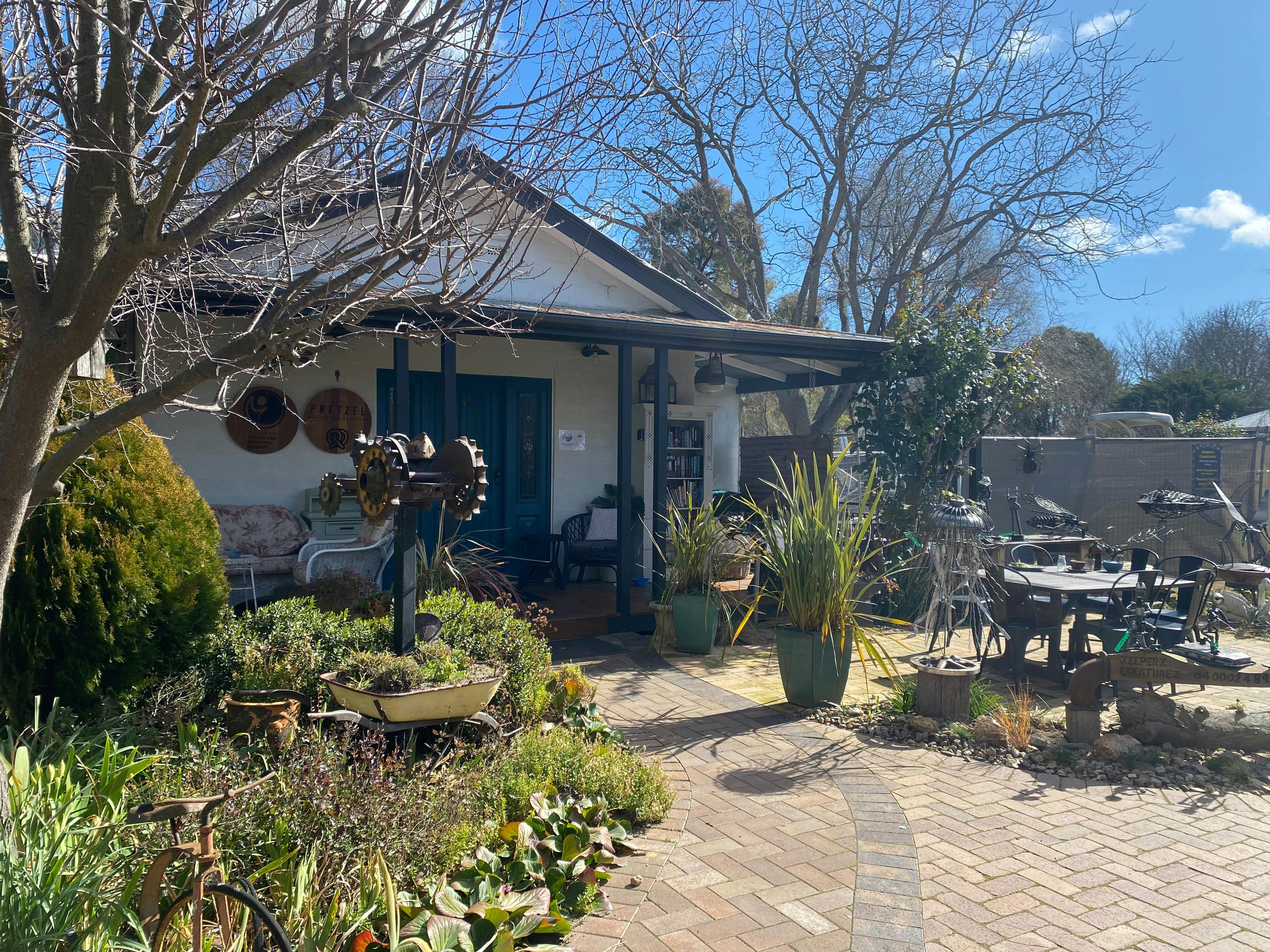 Exterior of the building. Beautiful gardens and eating and seating areas shared with local cafe.