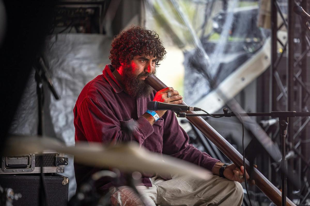 Nathan Lygon plays didgeridoo at a Giiyong event