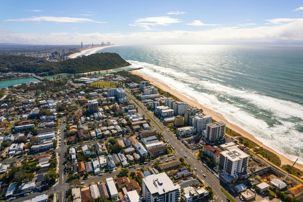North to Burleigh Heads, with the skyline on the horizon. Aerial view north along Palm Beach towards