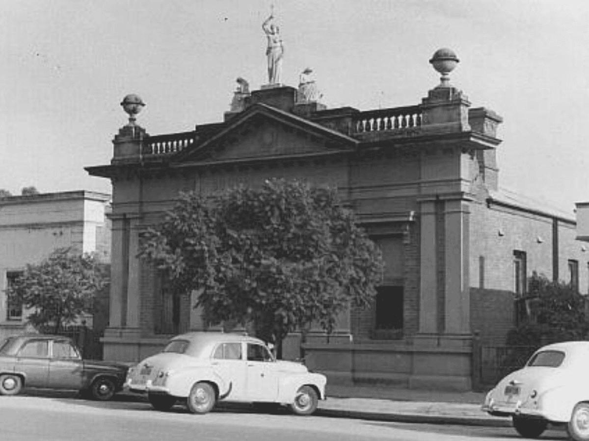 The Three Muses in their original spot on the School of Arts building