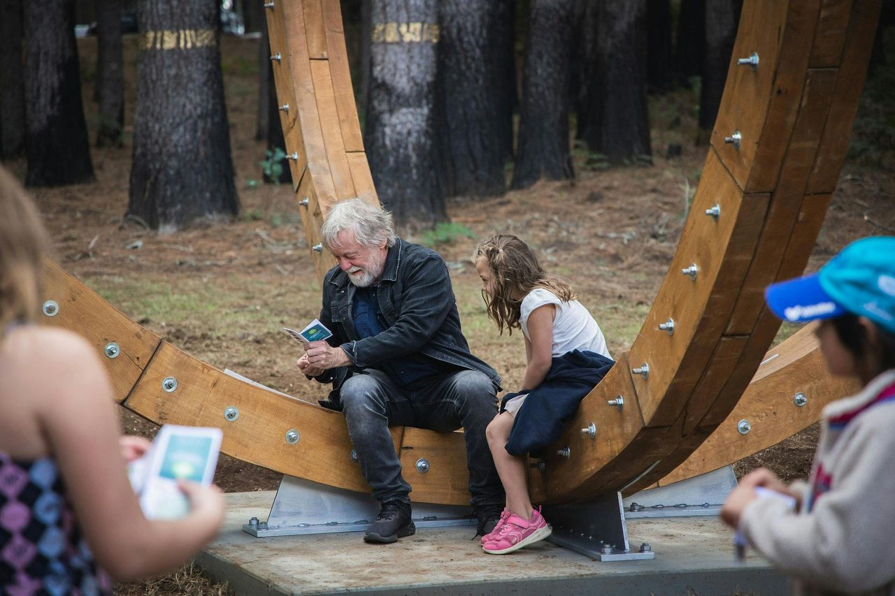Visitors at 'Universum' sculpture, Pilot Hill arboretum
