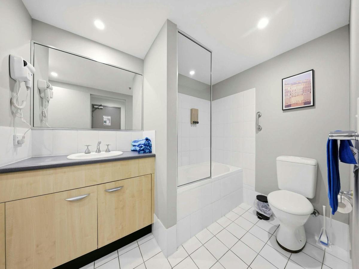 Bathroom with vanity and shower