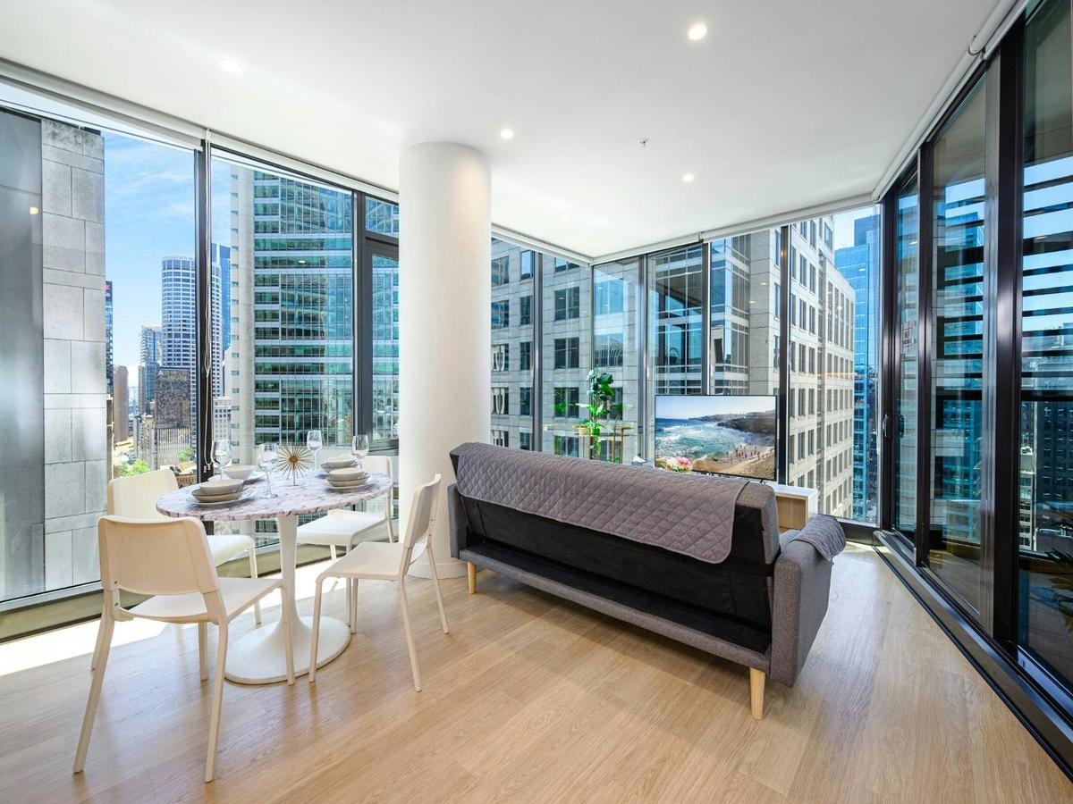 Large lounge area with expansive windows and dining space.