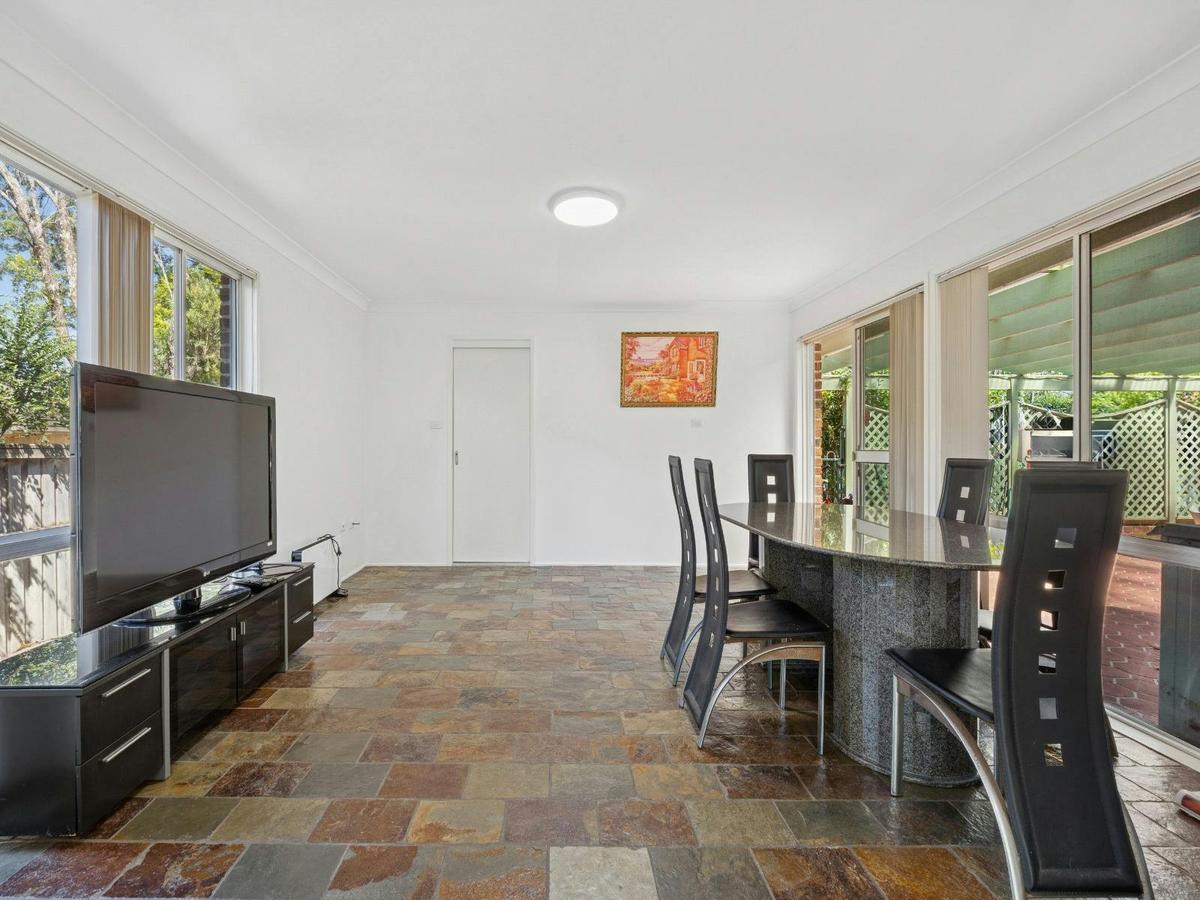 Common living and dining area with TV, dining table, and open-plan layout