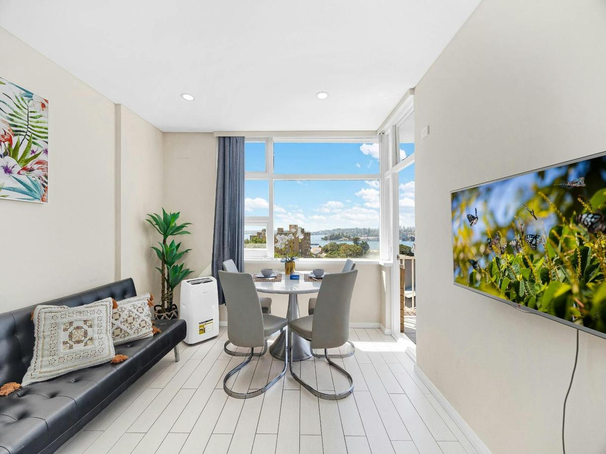 Living area with sofa seating and direct access to balcony views. (Includes sofa bed)