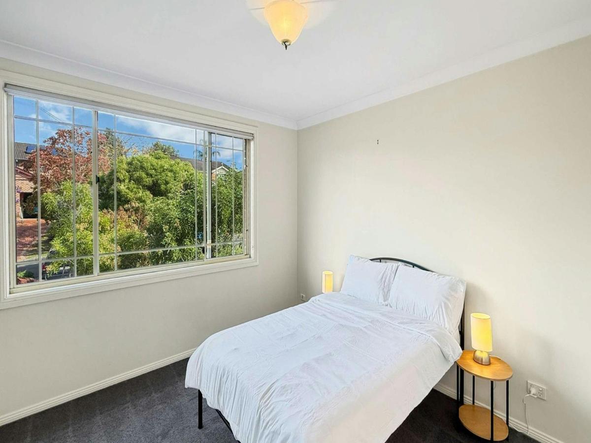 Sunny bedroom overlooking greenery