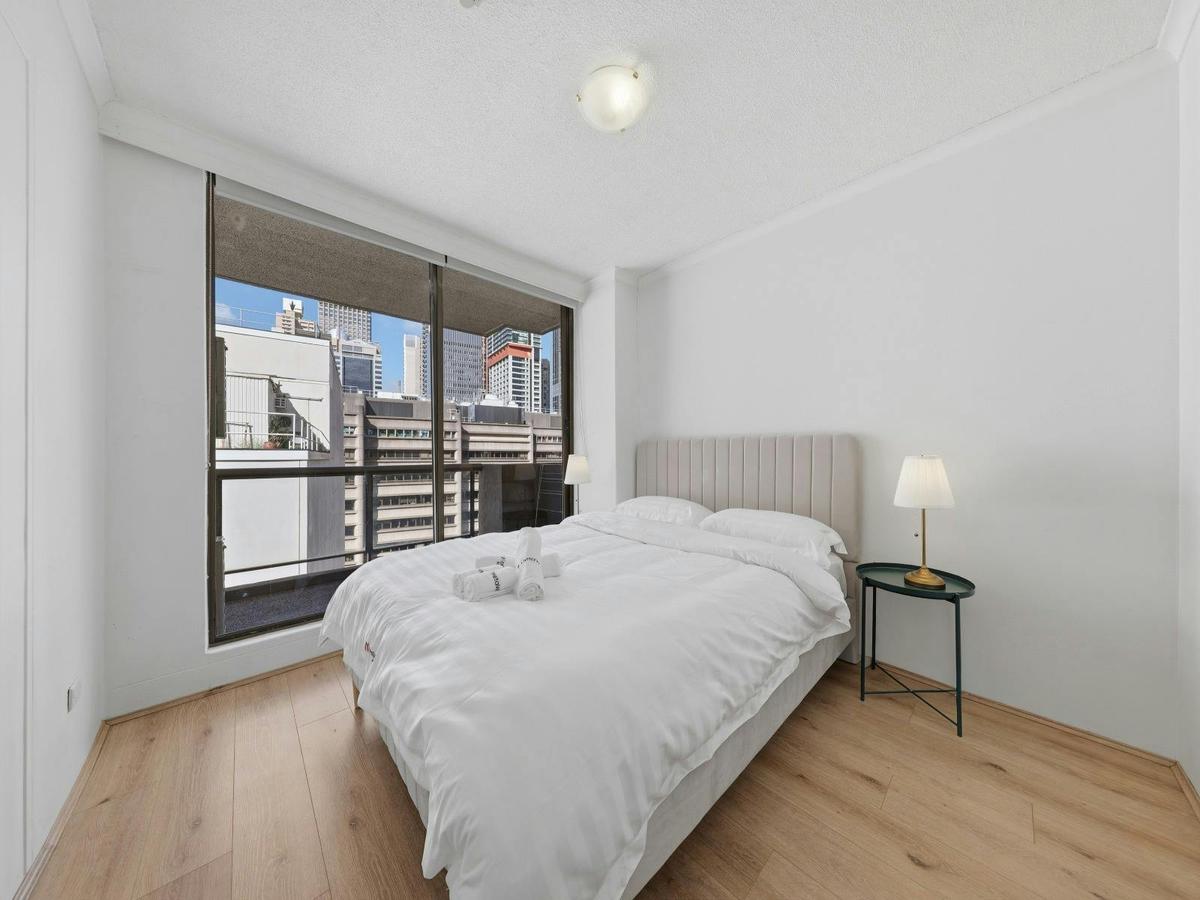 Spacious bedroom with large window views