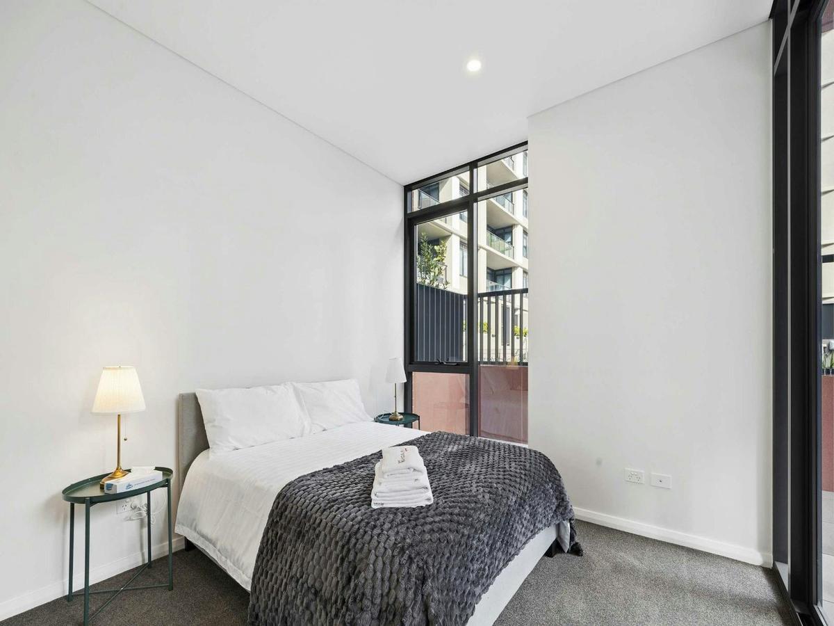 Bright bedroom with double bed, bedside table, and contemporary décor.