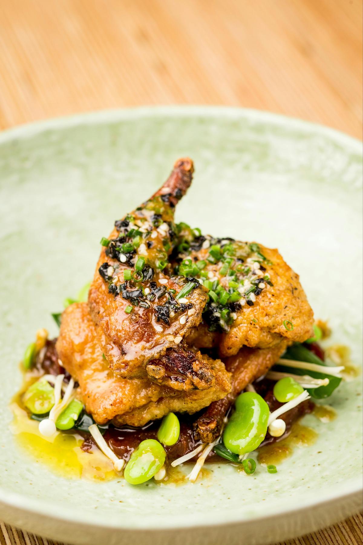 Rannock farm crispy jumbo quail, tamarind, broad beans, enoki, kombu butter